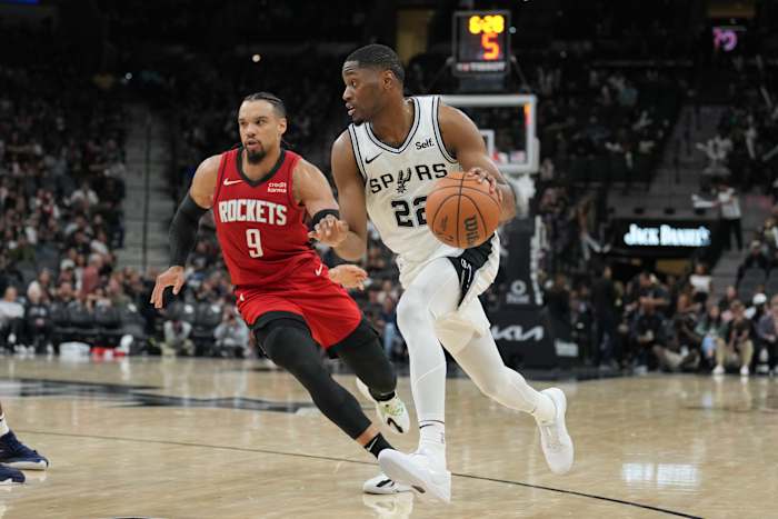 San Antonio Spurs guard Malaki Branham (22) dribbles past Houston Rockets guard Dillon Brooks (9) in the second half at the Frost Bank Center.